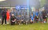 MK United U15 celebrates being league champions in a group shot with a banner states 2024-25 winners