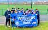 MK United U14 celebrates being league champions in a group shot with a banner states 2022-23 winners
